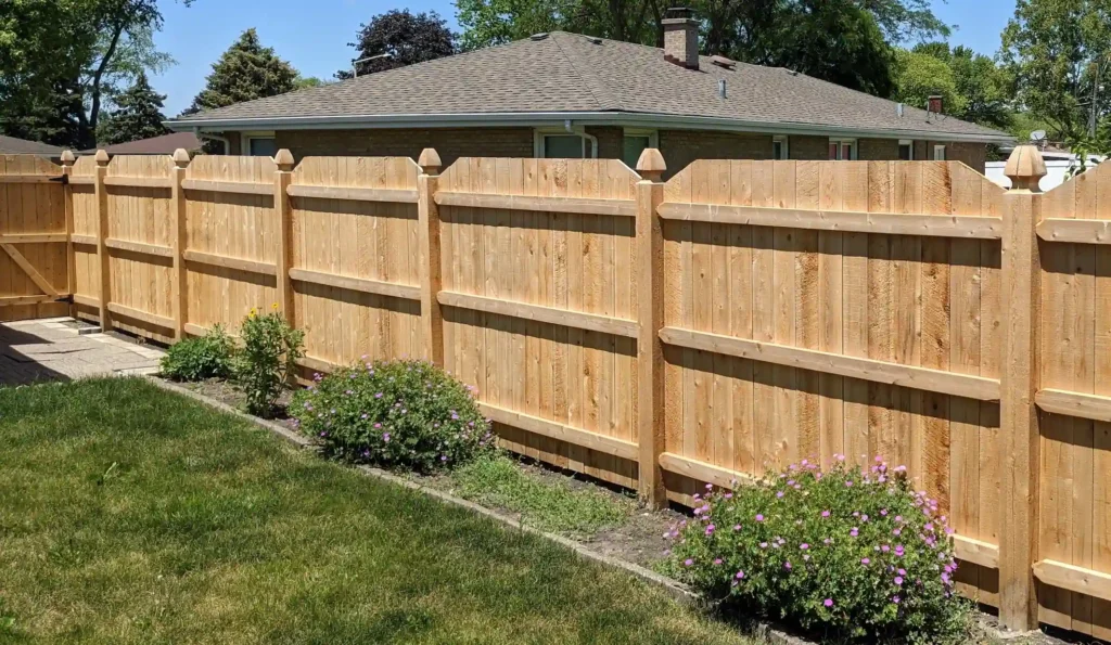 Wood board fence along a suburban backyard
