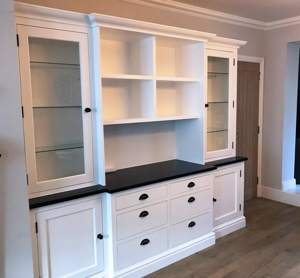White built-in cabinet with glass doors and drawers
